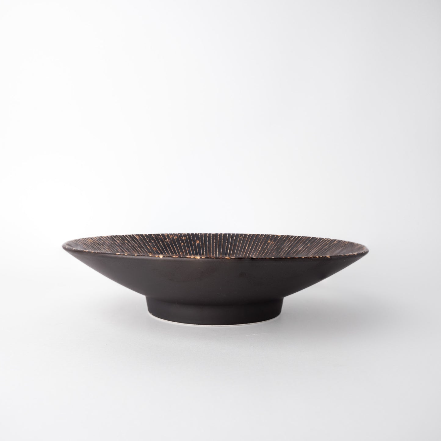 Black ceramic bowl on a white background