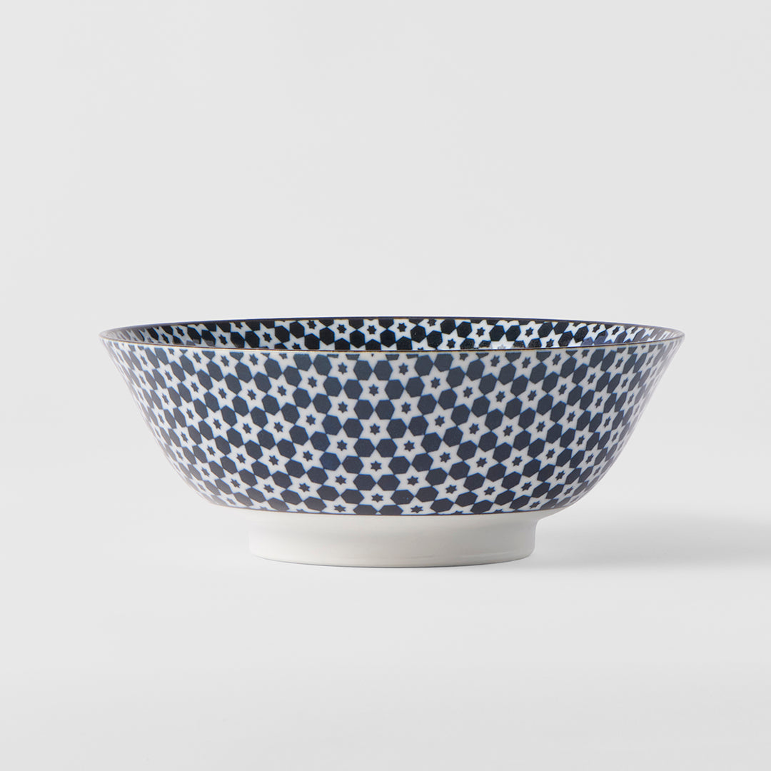 Ceramic bowl with blue floral pattern on a white background
