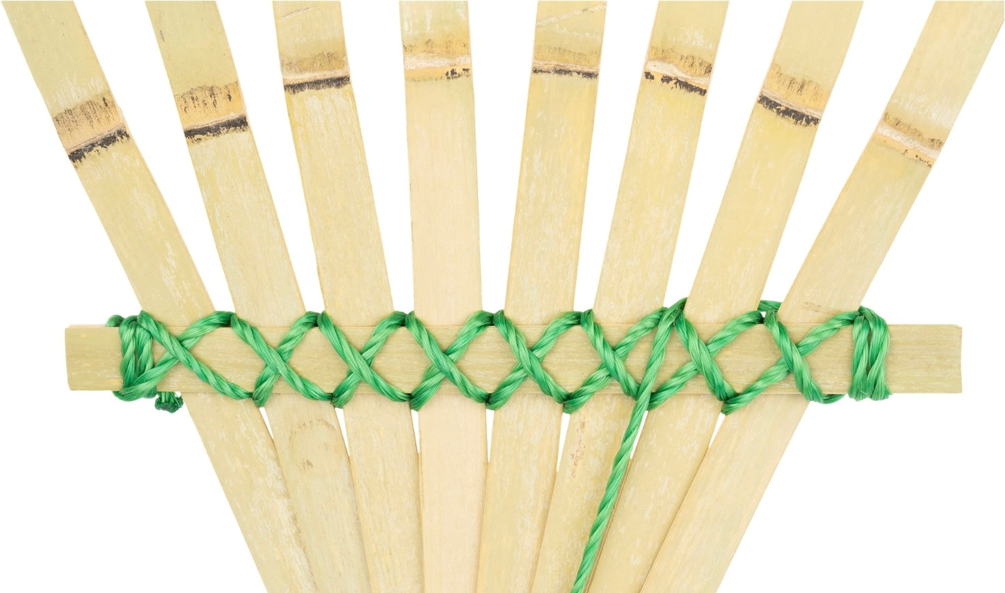 Bamboo straws with green woven pattern on a white background