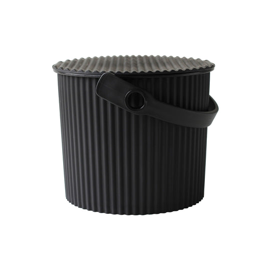 Black ribbed bucket with handle on a white background
