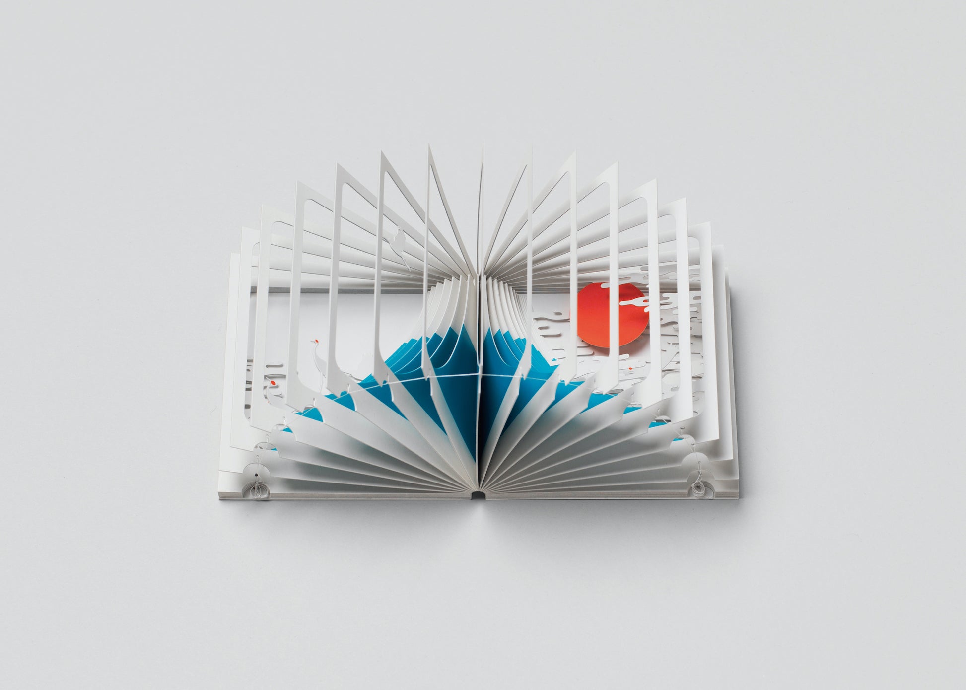 Open book with geometric design on a white background
