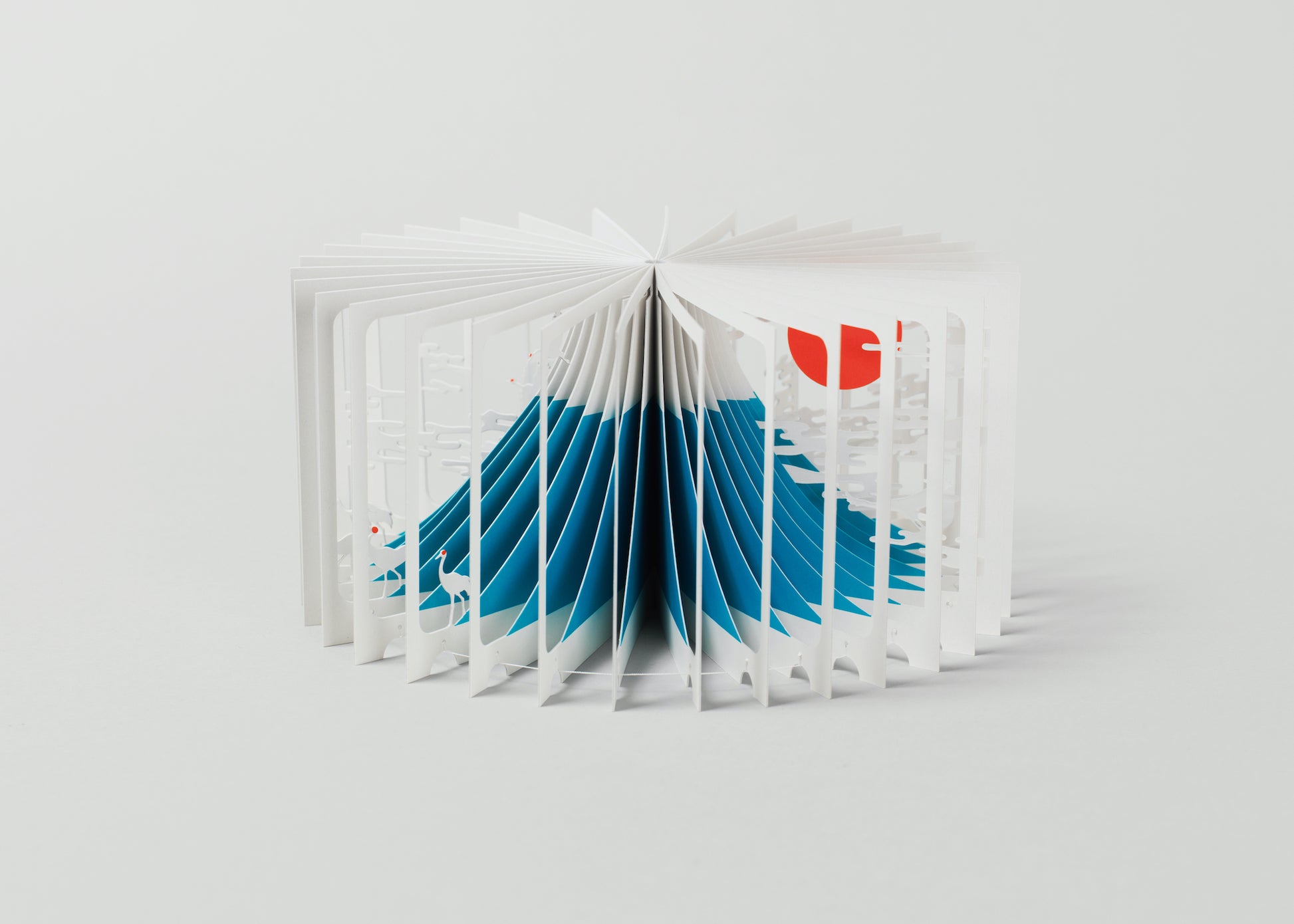 Open book with blue and red design on a white background