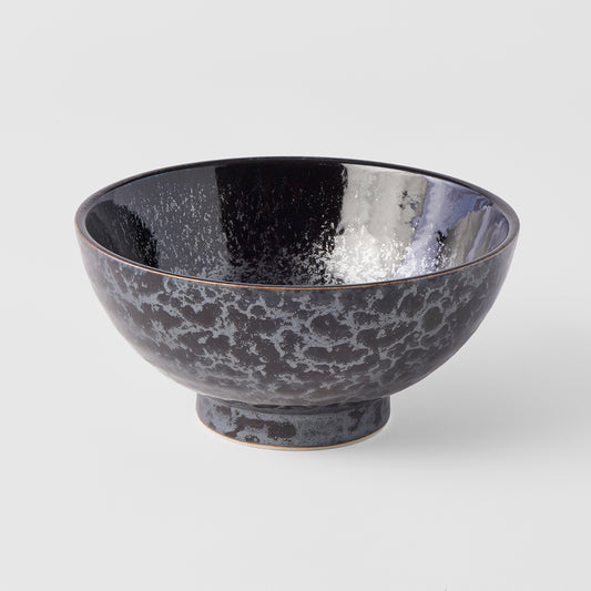 Black ceramic bowl on a white background