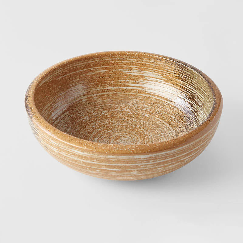 Wooden bowl with a natural finish on a white background