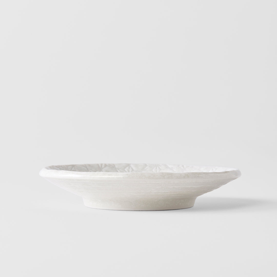 White ceramic bowl on a light gray background