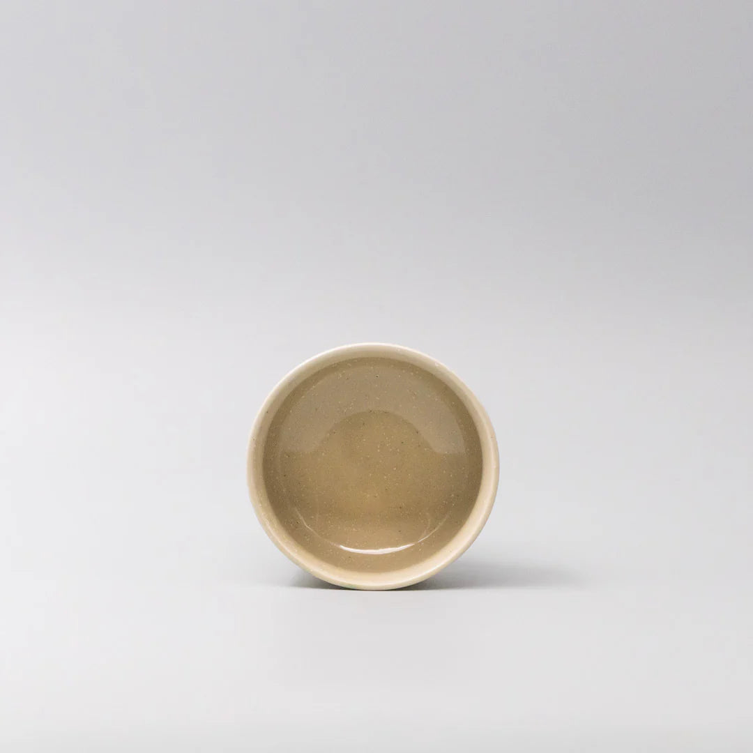 Small ceramic bowl on a light gray background