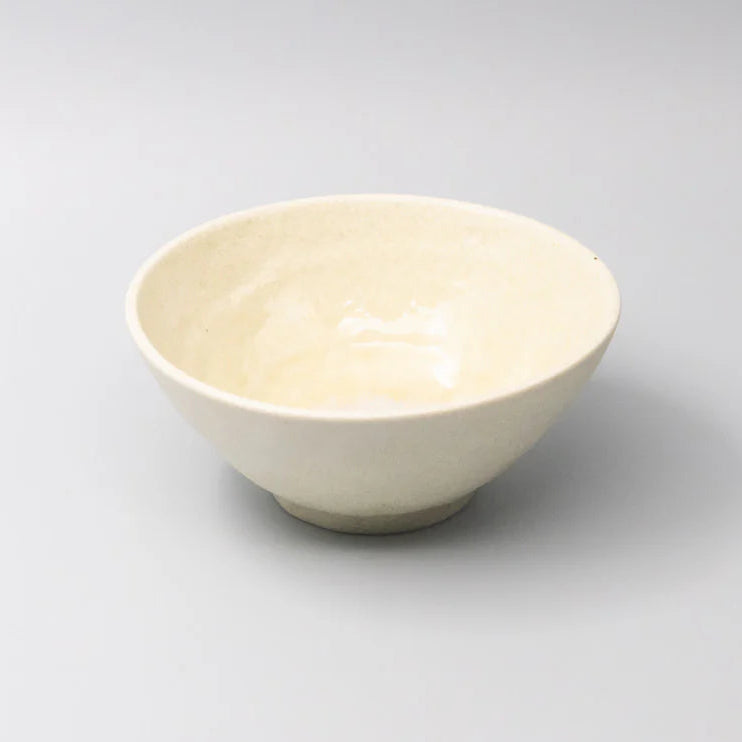 White ceramic bowl on a light gray background