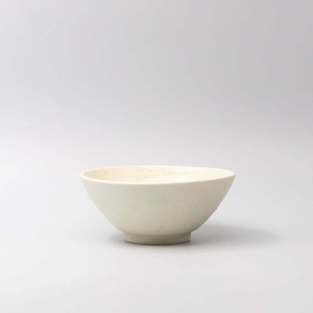 White ceramic bowl on a light gray background