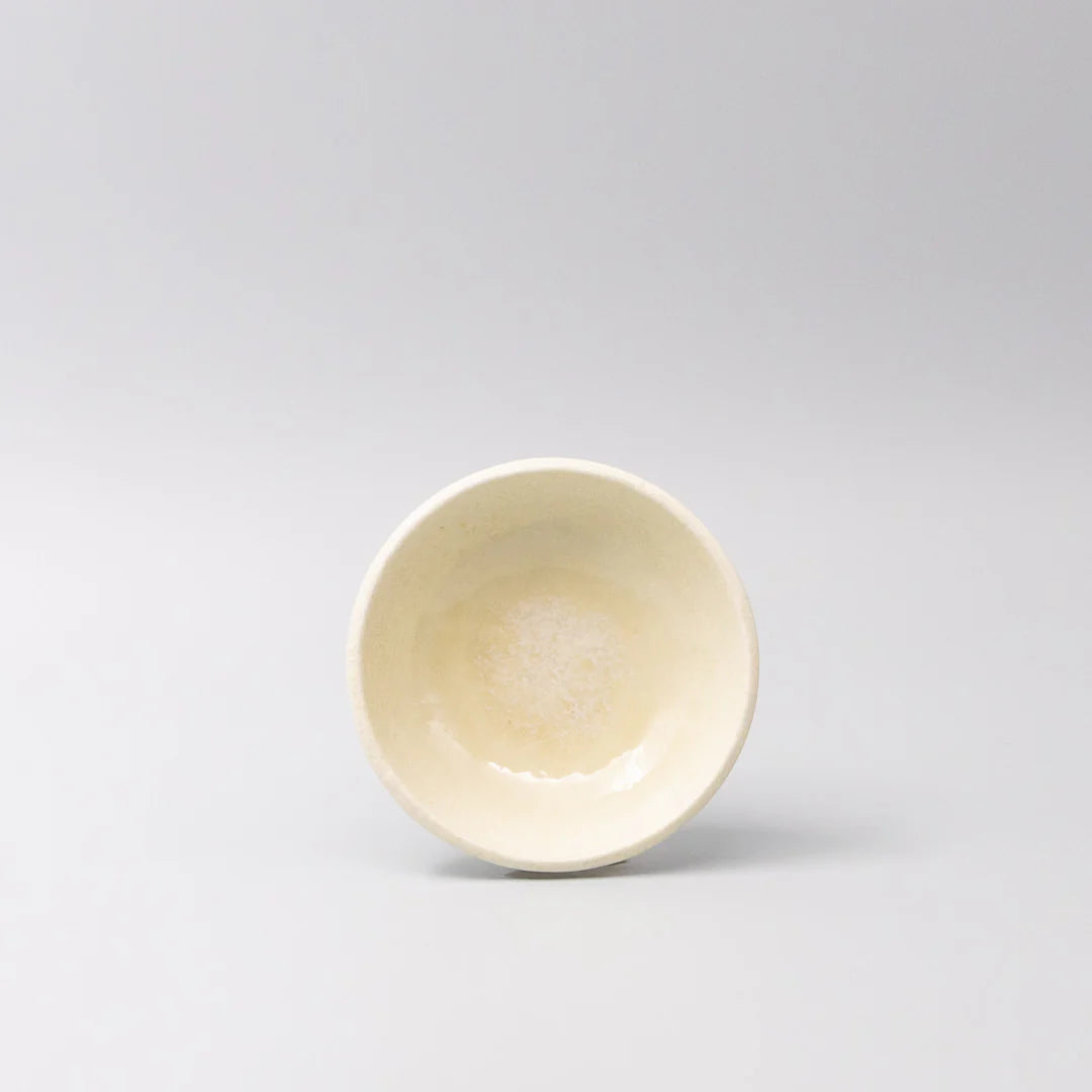 White ceramic bowl on a light gray background