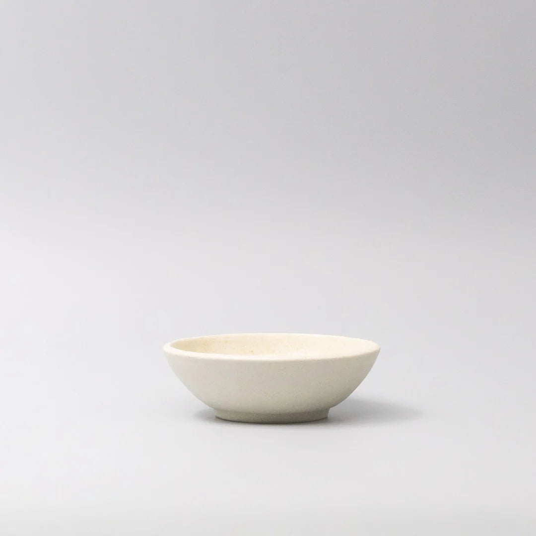 White ceramic bowl on a light gray background