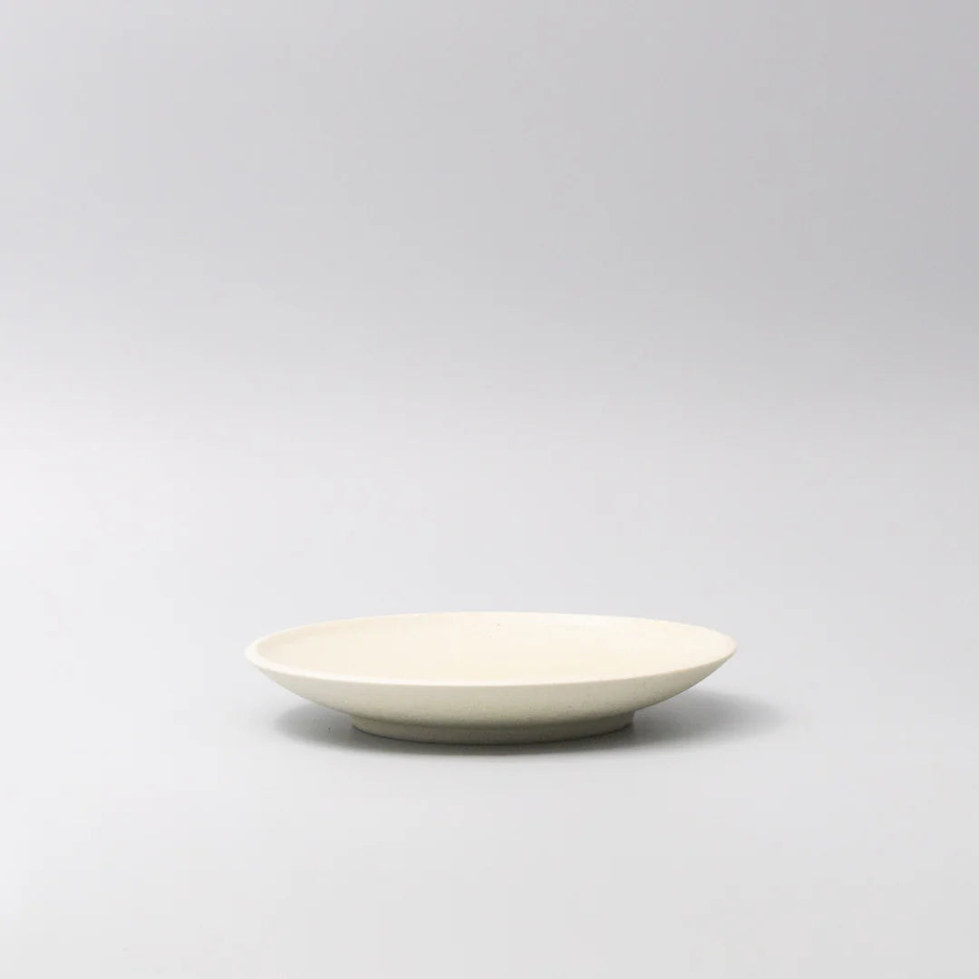 White ceramic bowl on a light gray background