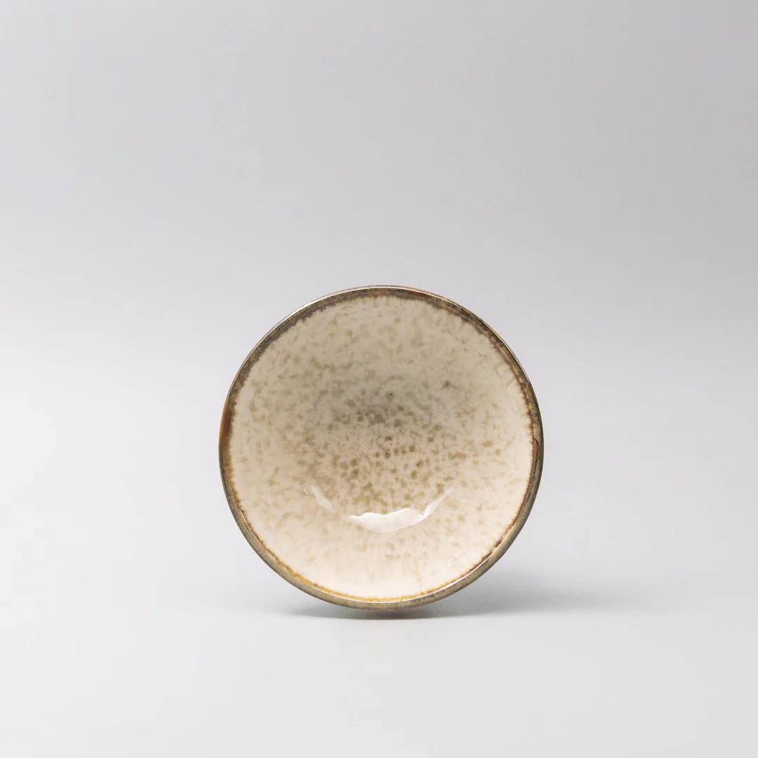Ceramic bowl with a textured surface on a light gray background