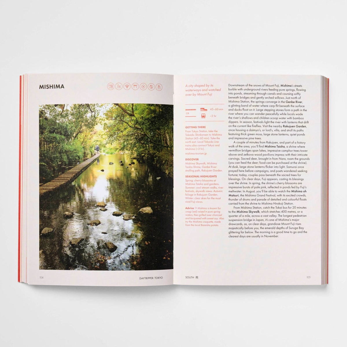 An open book or magazine spread on a light gray background, showing a scenic photograph of a forest stream on the left page and columns of text on the right page.