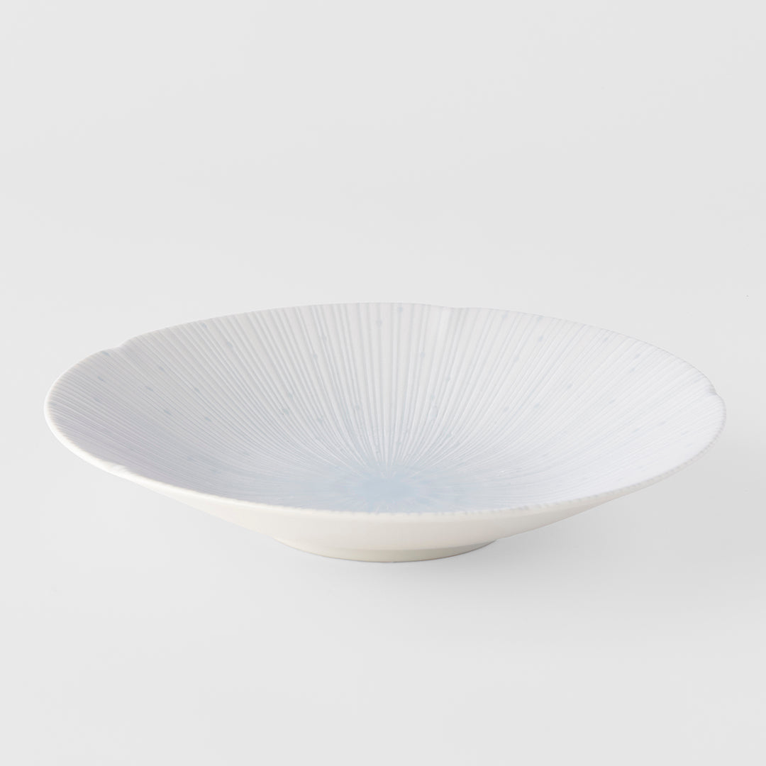 White ceramic bowl with a textured design on a white background