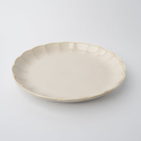 Beige ceramic plate on a light gray background