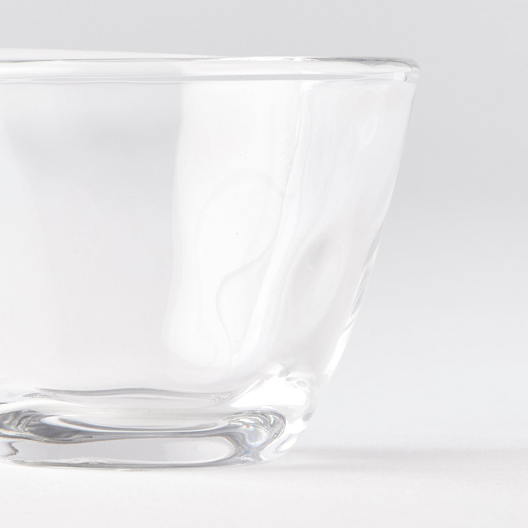 Clear glass bowl on a light gray background