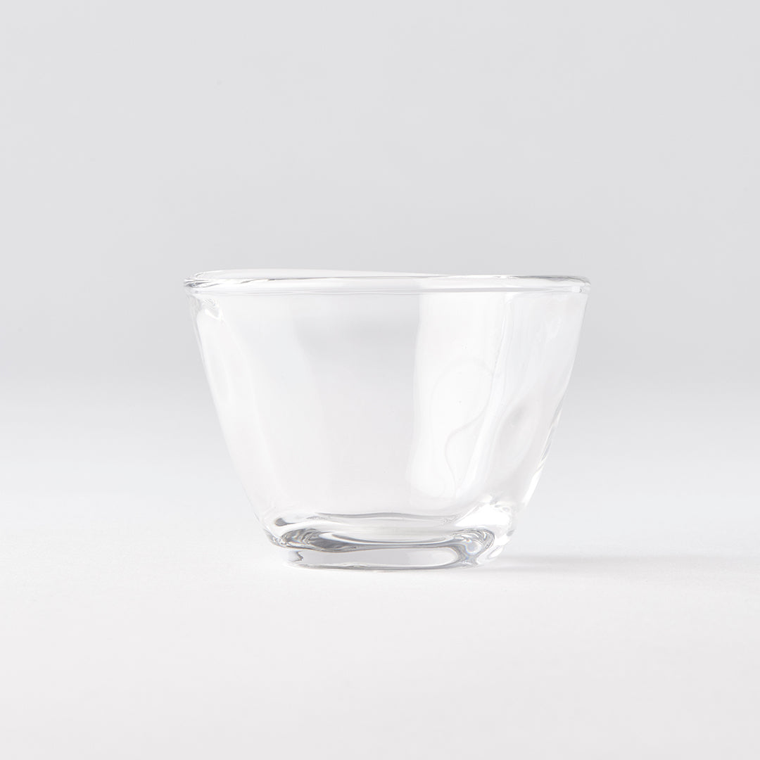 Clear glass bowl on a light gray background