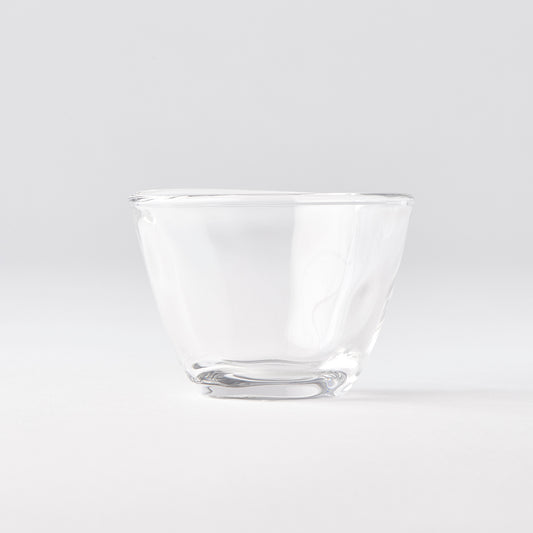 Clear glass bowl on a light gray background
