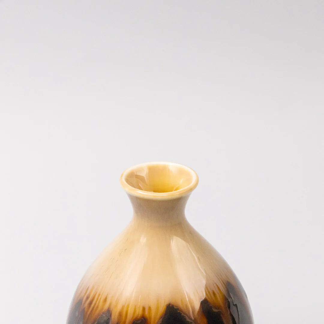 Vase with brown and beige gradient on a light gray background