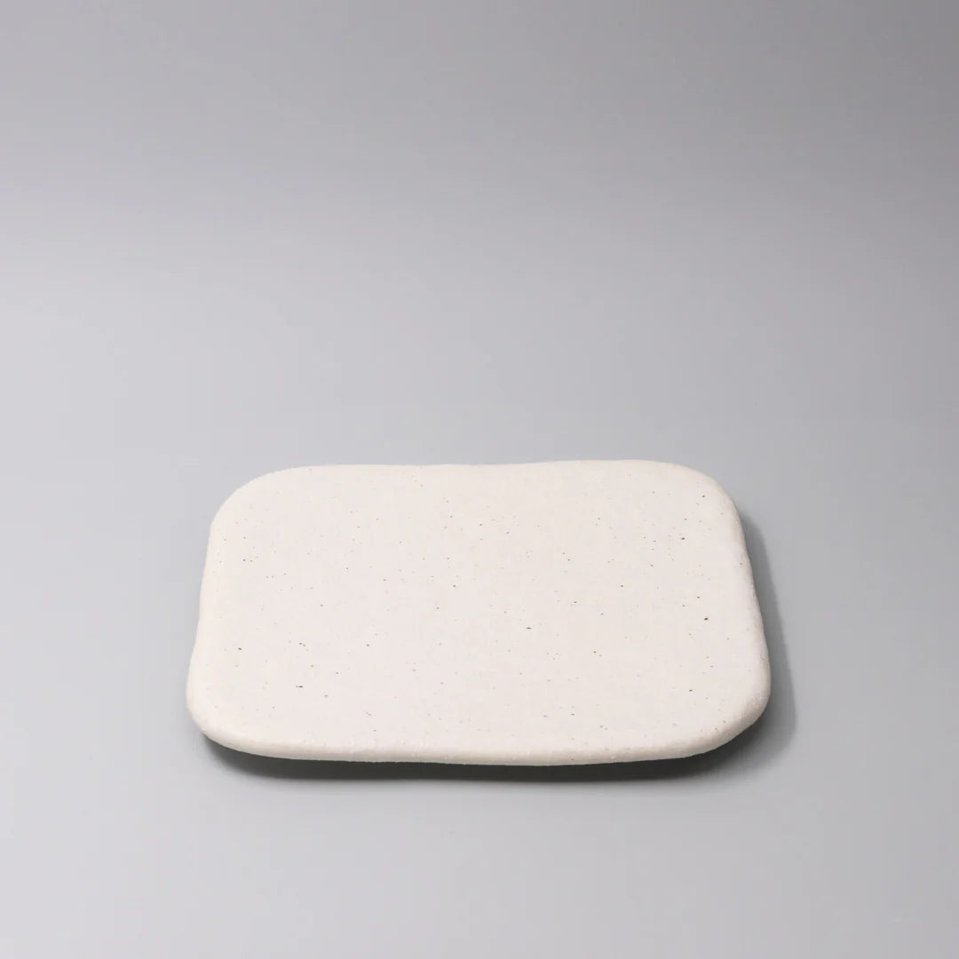 Rectangular white cushion on a gray background