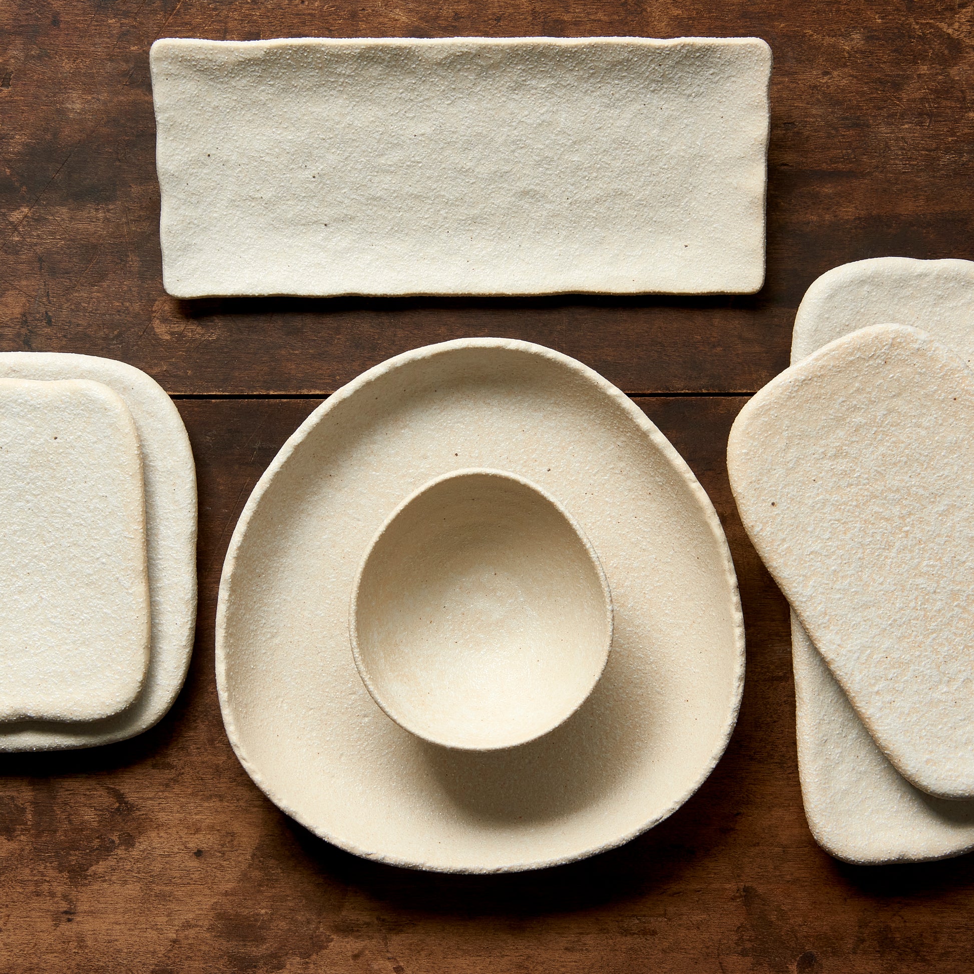 Set of ceramic dishes on a wooden surface
