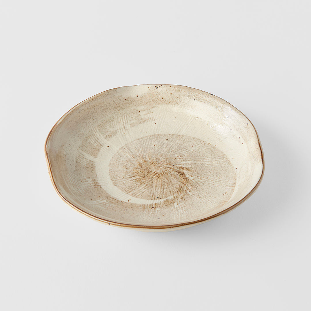 Ceramic bowl with textured surface on a light gray background