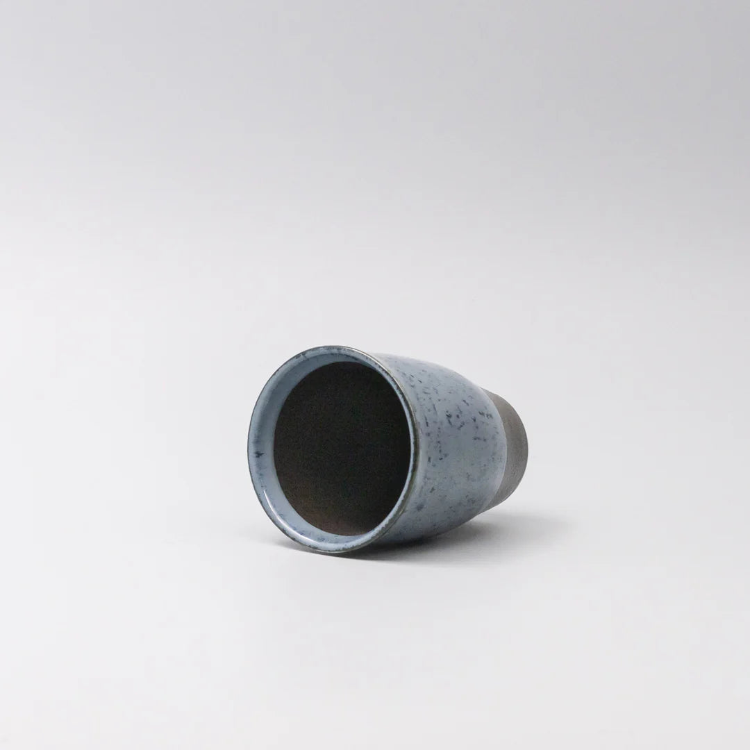 Cylindrical concrete object on a white background