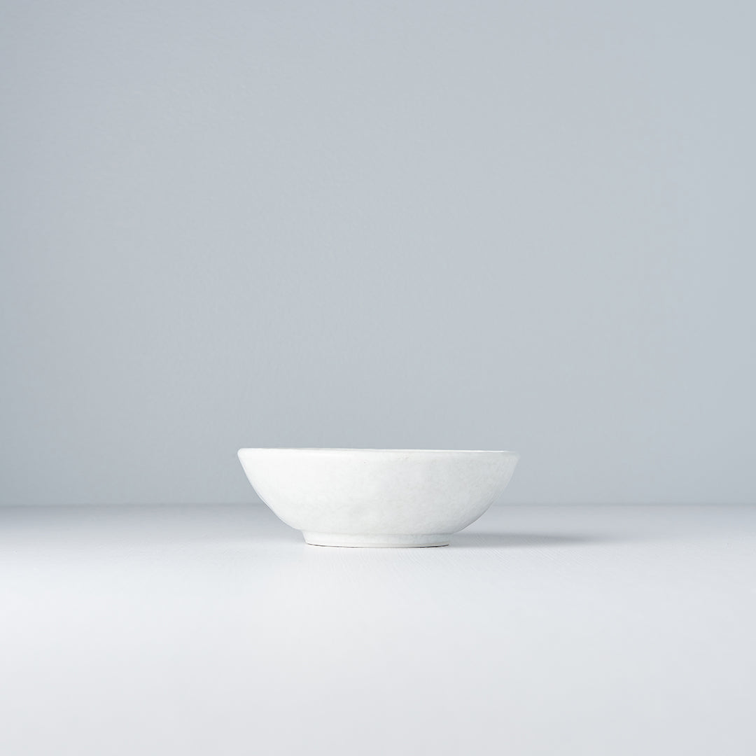White ceramic bowl on a light gray background
