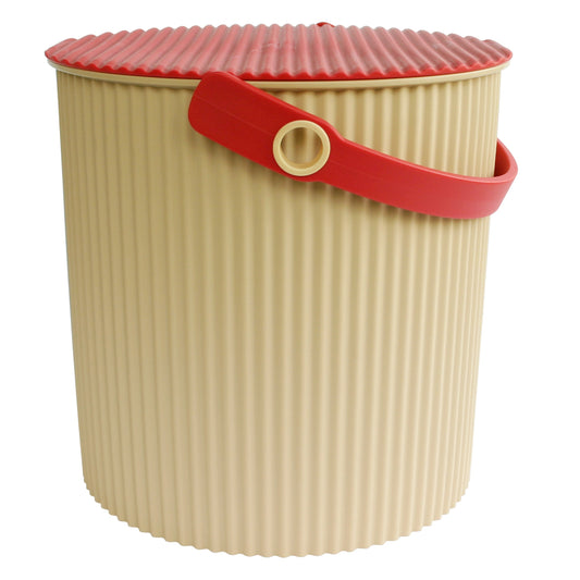 Beige laundry basket with a red lid and handle on a white background